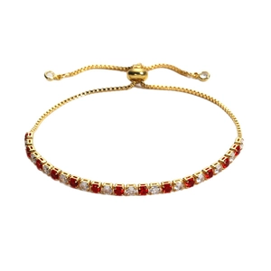 Adjustable gold tennis bracelet with alternating red and white round cubic zirconia stones