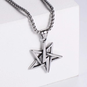 Pentagram and lightning bolt stainless steel pendant necklace on white stone display