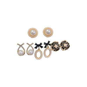 Elegant 4-pair earring set featuring vintage pearls, black camellias, and rhinestone accents