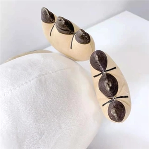 Close-up of high-quality plush toy stitching and soft white faux fur texture detail