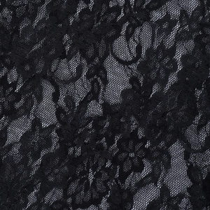 Close-up of black floral lace fabric with translucent mesh and high-density texture
