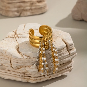 Three-layer matte gold open ring featuring pearl fringe tassels on stone backdrop