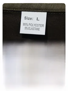 Detail showing garment care label with 95% polyester and size L on brown suede fabric