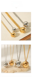 Detailed comparison of 18K gold and silver polished sphere pendants on fine link chains