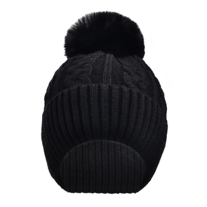 Close-up of black cable knit beanie with fluffy pom-pom and elastic ribbed cuff details