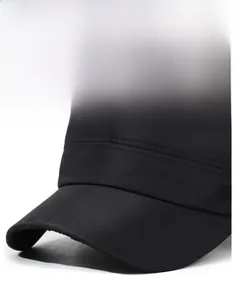 Detailed close-up of a stiff black flat cap brim featuring fine stitching and metal SPO tag