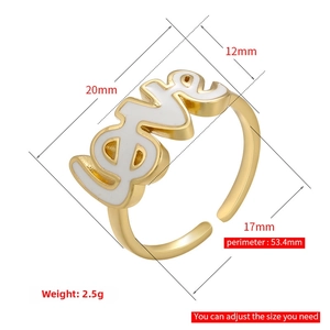 Detailed view of adjustable gold LOVE ring with white enamel and star heart zircon