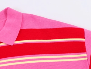 Detail of knitted polo shirt collar with red, pink, and beige horizontal stripes