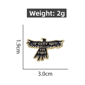 Detailed view of enamel bird brooch with IT CAN'T RAIN ALL THE TIME text and dimensions