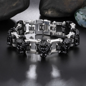 Detailed close-up of a men's stainless steel lion head biker chain bracelet in black and silver