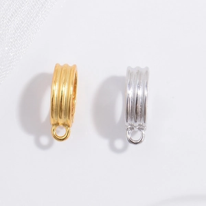 S925 sterling silver pinch bails for pendants in gold and silver finish on white silk