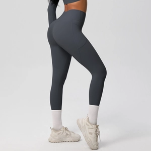 Detail of high waisted yoga leggings in charcoal grey with functional side pockets