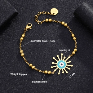 Detail of evil eye sunburst pendant in gold plated stainless steel with 18cm chain