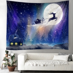 Christmas tapestry with Santa sleigh and starry sky hanging above a white sofa