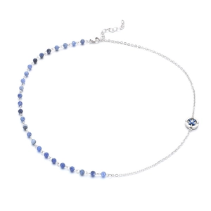 Minimalist necklace with blue beads, silver chain, and a North Star compass pendant