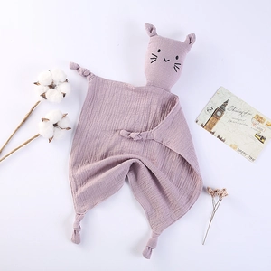 Detailed macro view of purple muslin cotton baby security blanket with cat head