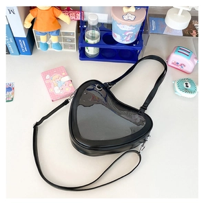 Macro shot of heart-shaped transparent PVC window on a black JK uniform ita bag