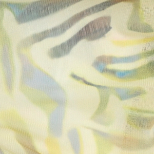 Macro detail of the lightweight mesh knit fabric with abstract colorful print texture