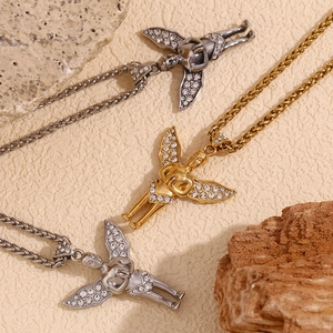 Detailed view of angel pendant necklaces in gold, silver and grey with crystal wings