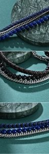 Detail of men's triple-layer lapis lazuli beads and braided leather magnetic bracelet