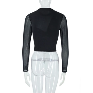 Close-up of black crop top featuring sheer mesh sleeves and opaque back panel detail