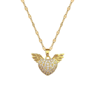 Elegant gold heart angel wing necklace with pavé crystal accents on white background