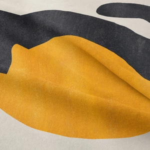 Macro shot of abstract yellow and black geometric pattern on heavy cotton tapestry fabric