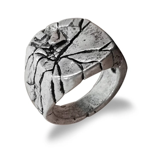 Vintage silver crackle texture ring for men with industrial aesthetic on white background