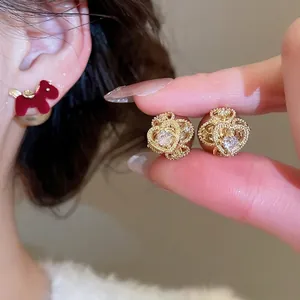 Elegant gold hollow heart earrings with sparkling zircon and red flocked pony charms