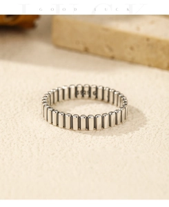 Macro shot of minimalist S925 sterling silver ring with bamboo textured geometric design