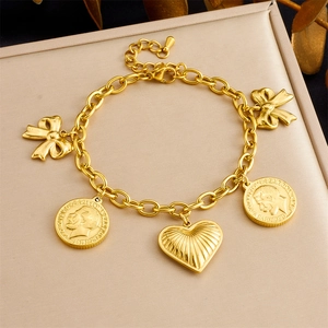 Bracelet vintage en acier inoxydable doré avec pendentifs pièces, nœuds et cœur