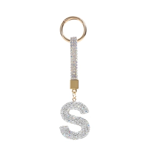 Detail of a sparkling gold letter S keychain with micro-pave crystal rhinestones