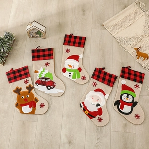 Set of 5 rustic Christmas stockings with plaid cuffs and festive burlap character designs