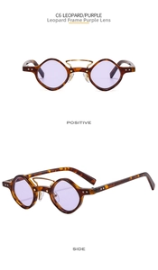 Detail view of leopard print punk sunglasses with purple lenses and gold double bridge