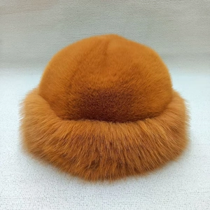 Detailed macro view of the ginger plush faux fur texture and thickened warm winter lining