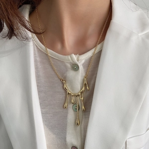 925 silver gold fluid metal pendant necklace featuring a dynamic liquid droplet design