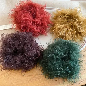 Set of four fluffy plush hair scrunchies in vintage red, yellow, purple, and green colors