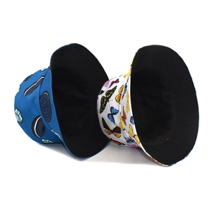 Reversible bucket hat with butterfly and blue cartoon print for summer sun protection