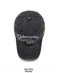 Top view of vintage washed grey baseball cap showing Discovery embroidery and texture