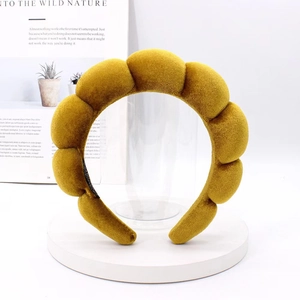 Detail of ginger yellow velvet padded headband with non-slip lining and premium texture