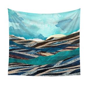 Detailed macro view of abstract mountain tapestry with blue gold hues and animal patterns