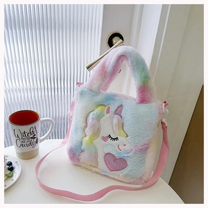 Detailed view of rainbow plush unicorn handbag with soft texture and pink adjustable strap