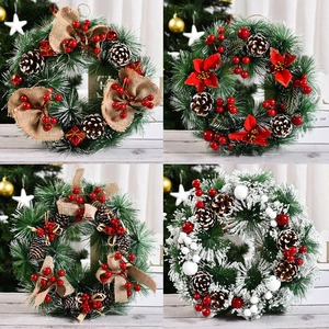 30cm Christmas wreath with pine needles, red berries, cones and rustic linen bows