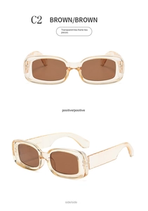 Detail view of small square tea brown sunglasses with transparent vintage resin frames