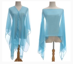 Detailed view of lightweight light blue chiffon shawl on a model in a studio setting