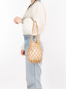 Handwoven beige cotton mesh bucket bag with white inner lining for summer beach outings