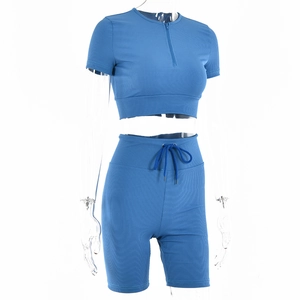 Detail of blue ribbed knit two-piece set featuring half-zipper collar and drawstring shorts