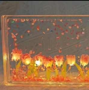 Detailed close-up of a DIY tulip night light with warm LED lighting and pink flower petals