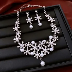 French floral jewelry set with pearl necklace and drop earrings in sparkling silver finish
