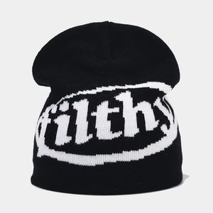 Detailed knit texture of black beanie with white filthy jacquard lettering on front